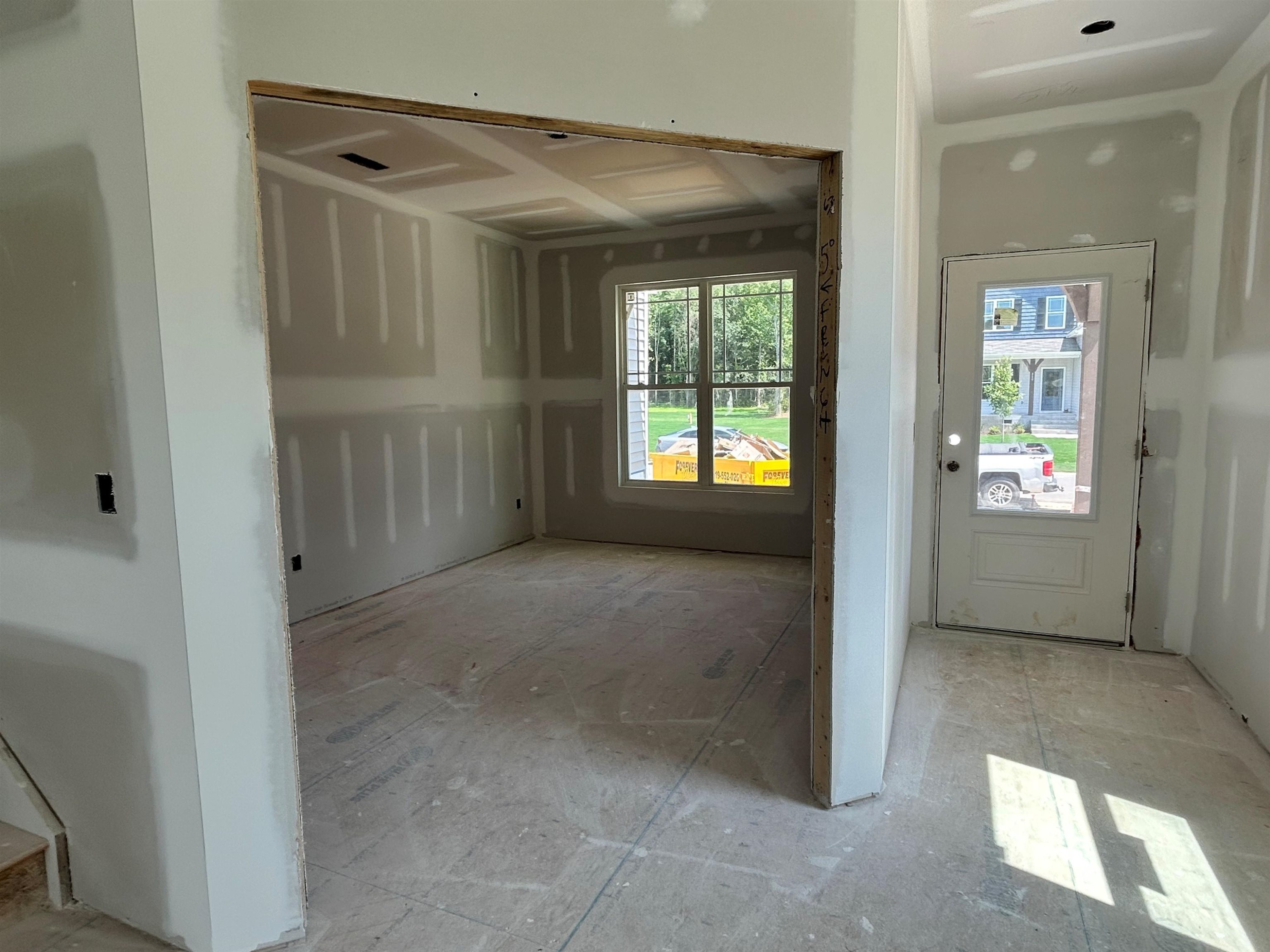 267 Madden Rose Loop Garner, NC 27529 - Photo 7 of 41 a view of an empty room with a window