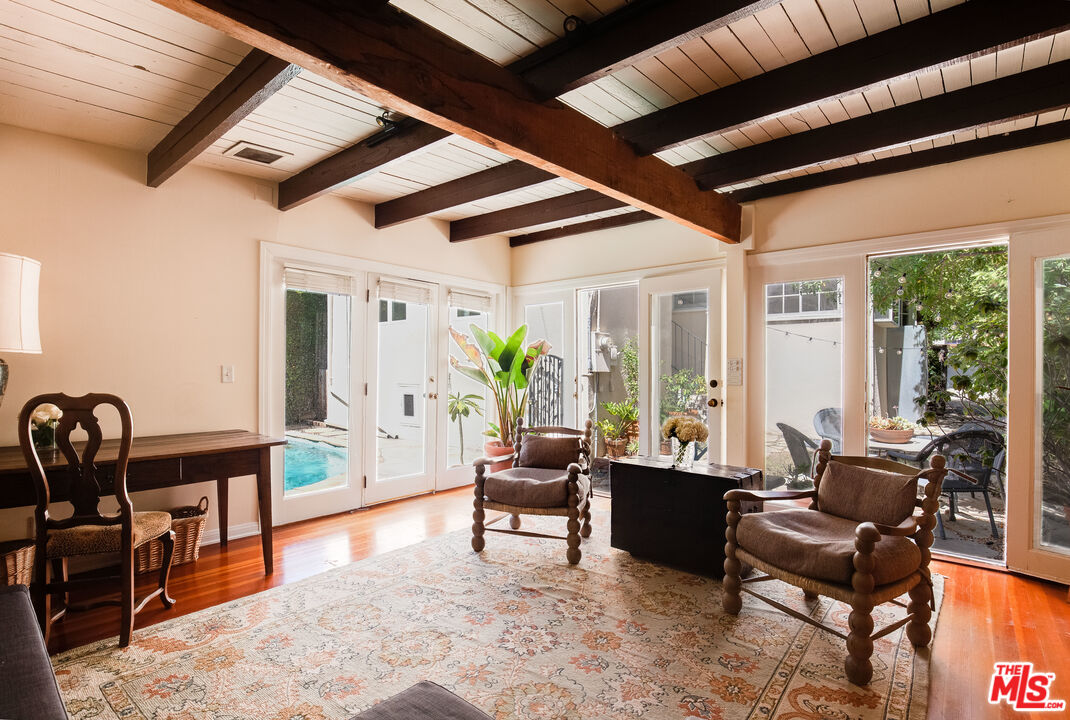 9018 Elevado Avenue West Hollywood, CA 90069 - Photo 27 of 32 a living room with furniture and a large window