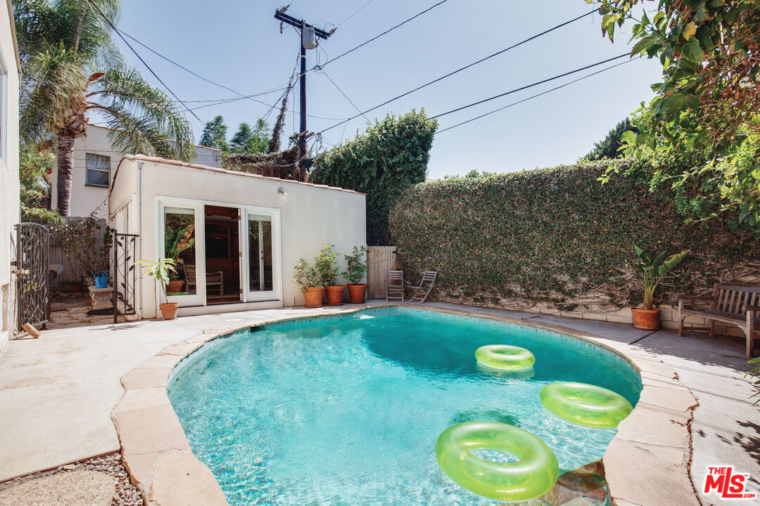 9018 Elevado Avenue West Hollywood, CA 90069 - Photo 3 of 32 a view of a house with a backyard