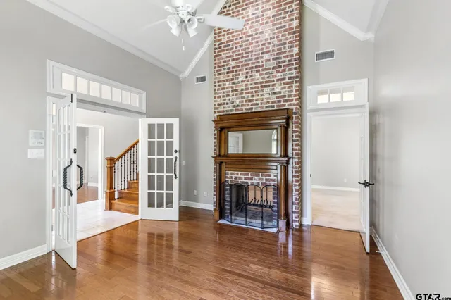 a bathroom with a tub a double vanity sink a mirror a window and a shower