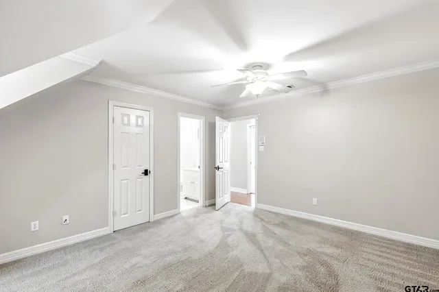 a bathroom with a sink a large mirror and a window