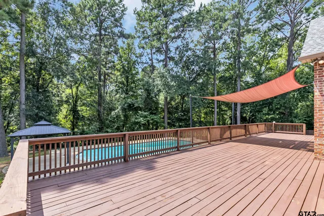 an aerial view of a house with swimming pool