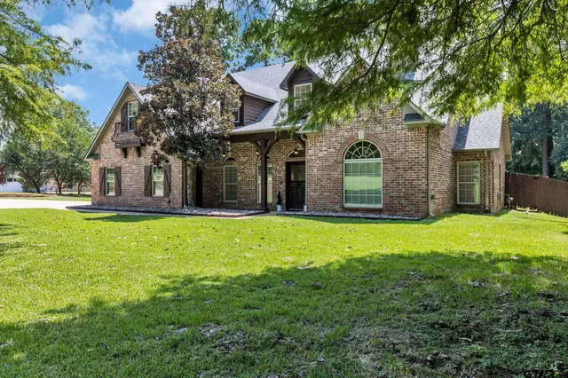 a kitchen with stainless steel appliances a stove a sink and a microwave