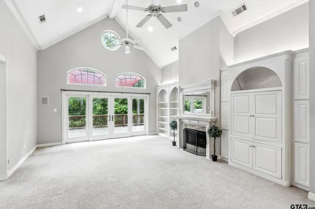a view of livingroom with furniture fireplace and window