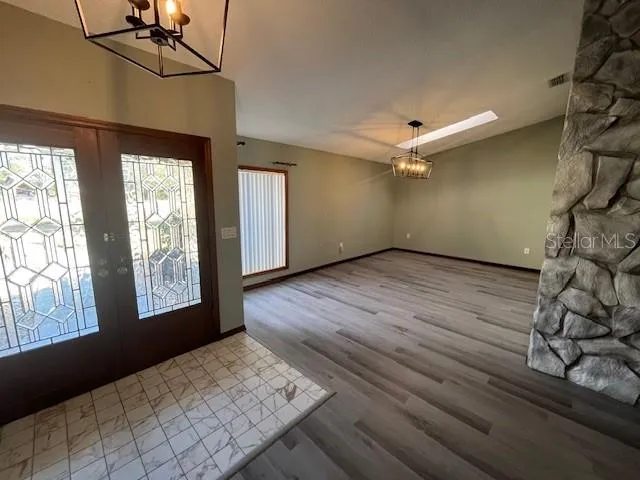 a kitchen with stainless steel appliances a stove a sink and a refrigerator