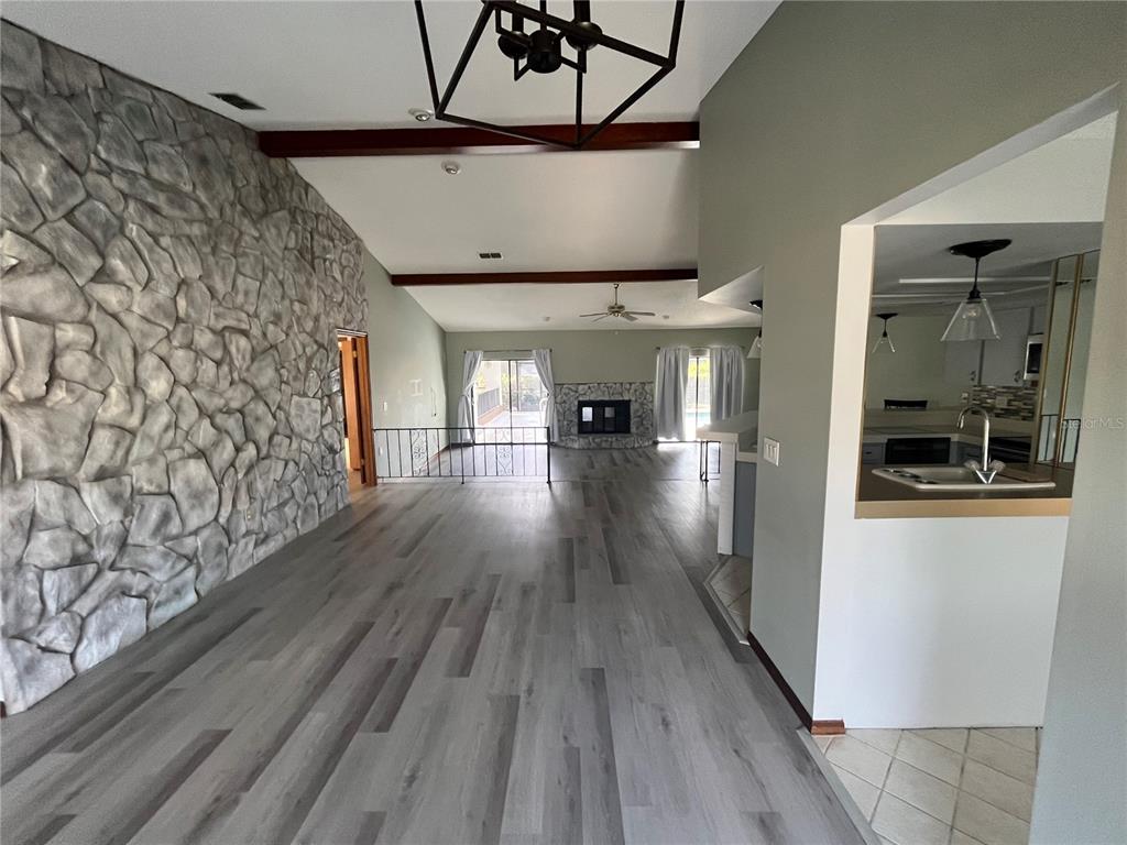 5375 Patricia Place Weeki Wachee, FL 34607 - Photo 12 of 61 a view of a hallway with wooden floor