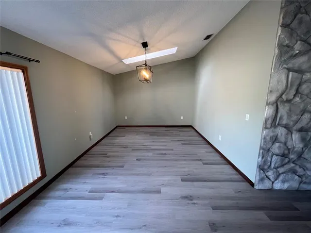 a kitchen with stainless steel appliances a refrigerator sink and microwave