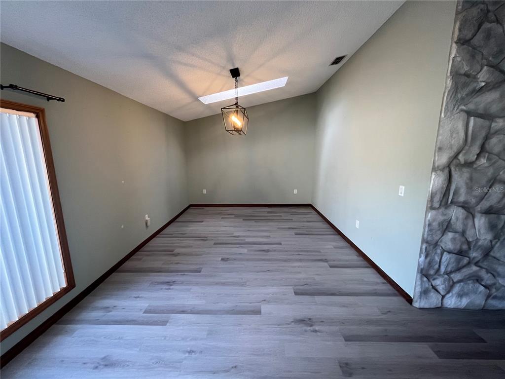 5375 Patricia Place Weeki Wachee, FL 34607 - Photo 13 of 61 wooden floor in an empty room