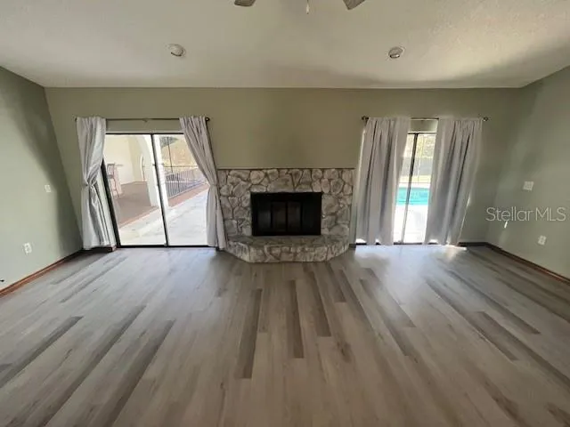 a kitchen with granite countertop a refrigerator and a sink