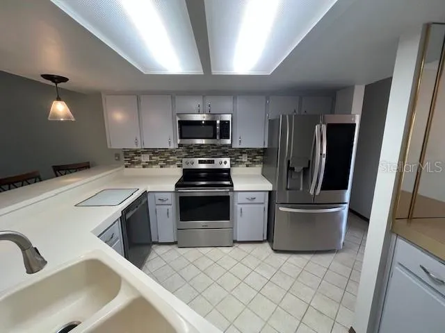 a bathroom with a toilet and a bathtub