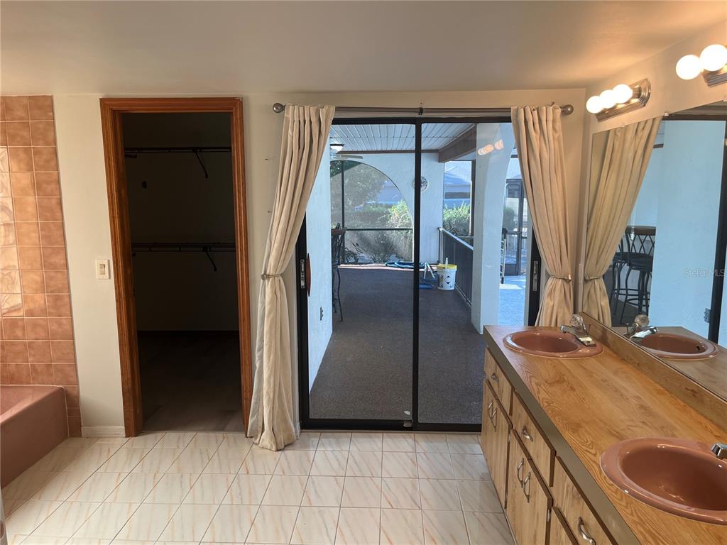 5375 Patricia Place Weeki Wachee, FL 34607 - Photo 28 of 61 a kitchen with granite countertop a refrigerator and a sink