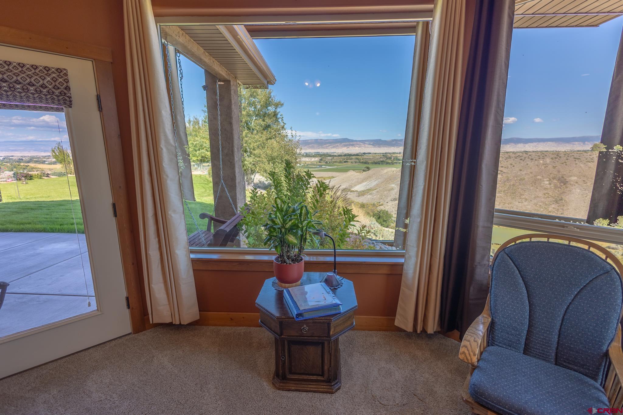 9550 High Mesa Road Olathe, CO 81425 - Photo 11 of 43 a room with furniture and a window