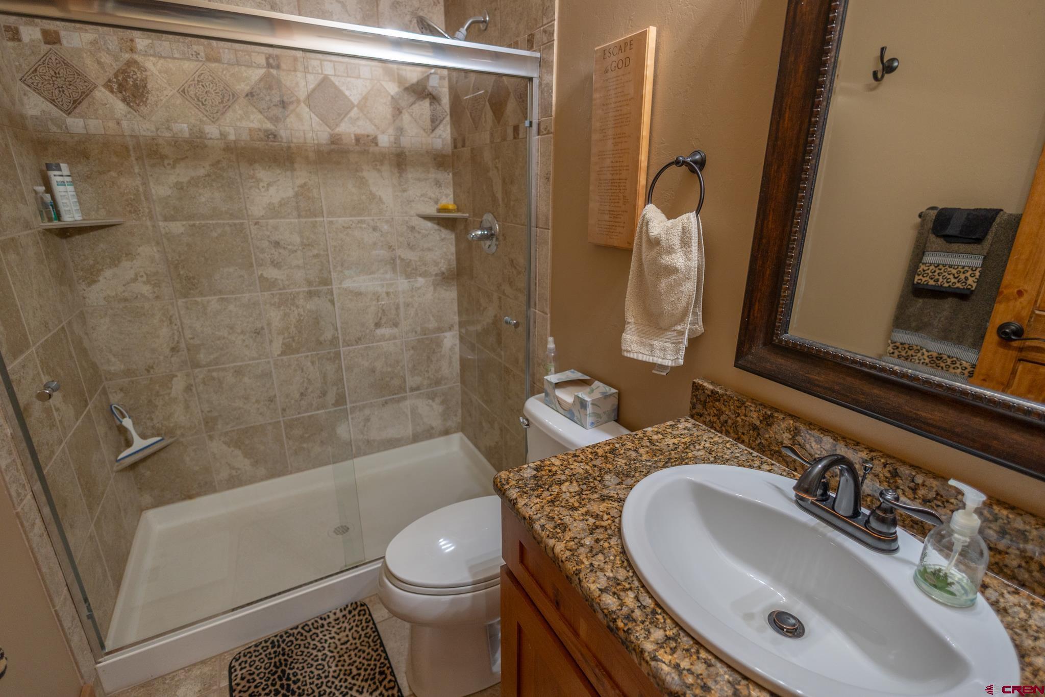 9550 High Mesa Road Olathe, CO 81425 - Photo 20 of 43 a bathroom with a sink and a mirror