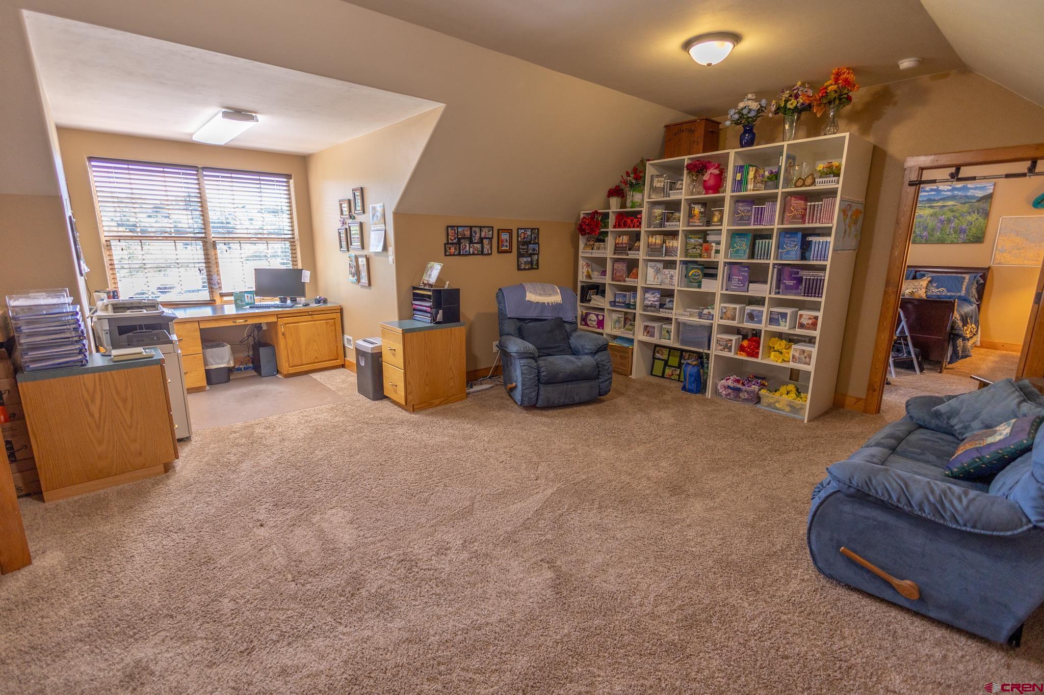 9550 High Mesa Road Olathe, CO 81425 - Photo 22 of 43 a living room with furniture and a large window