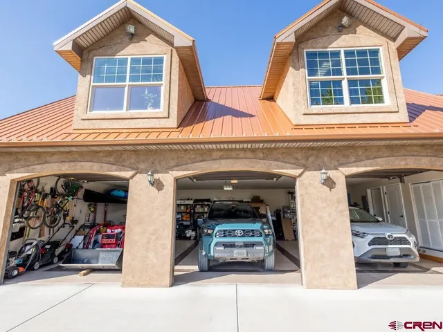 a view of a garage with rack and furniture