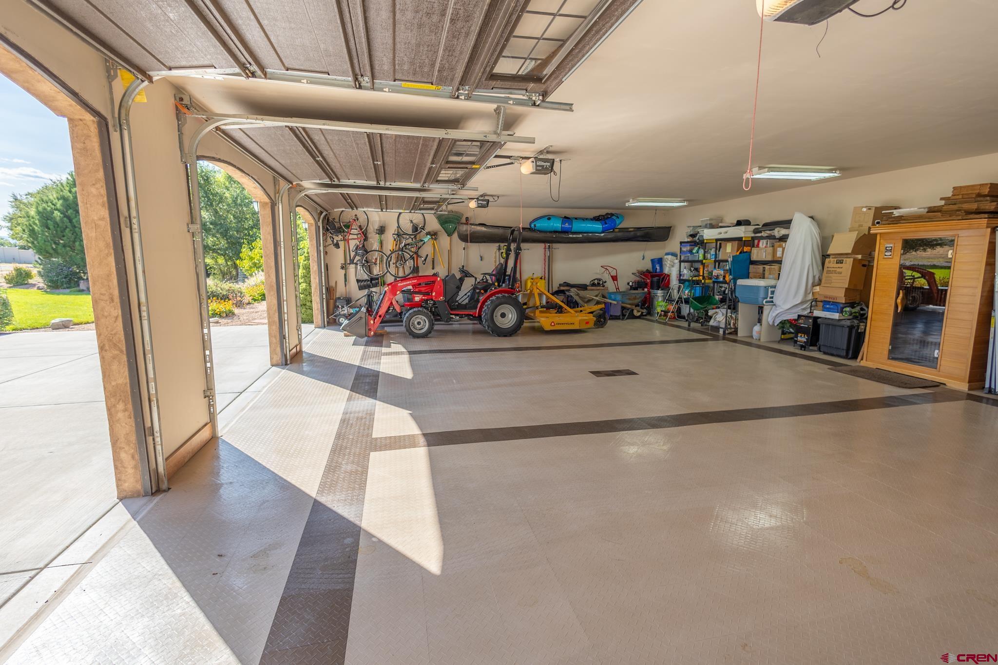 9550 High Mesa Road Olathe, CO 81425 - Photo 26 of 43 a view of a garage with rack and furniture