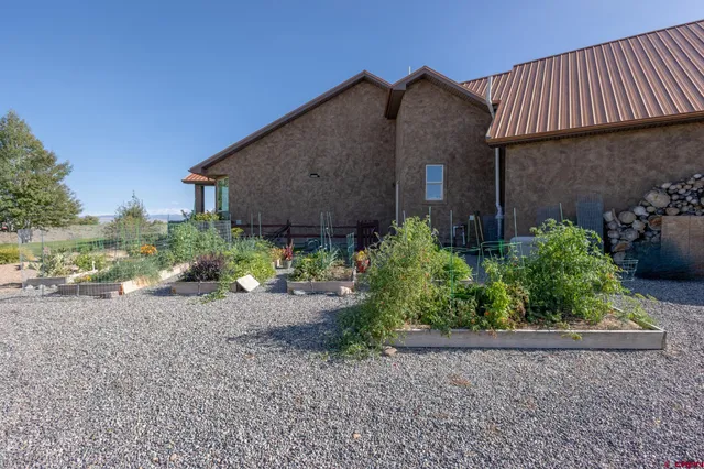 a view of a garden with a lake