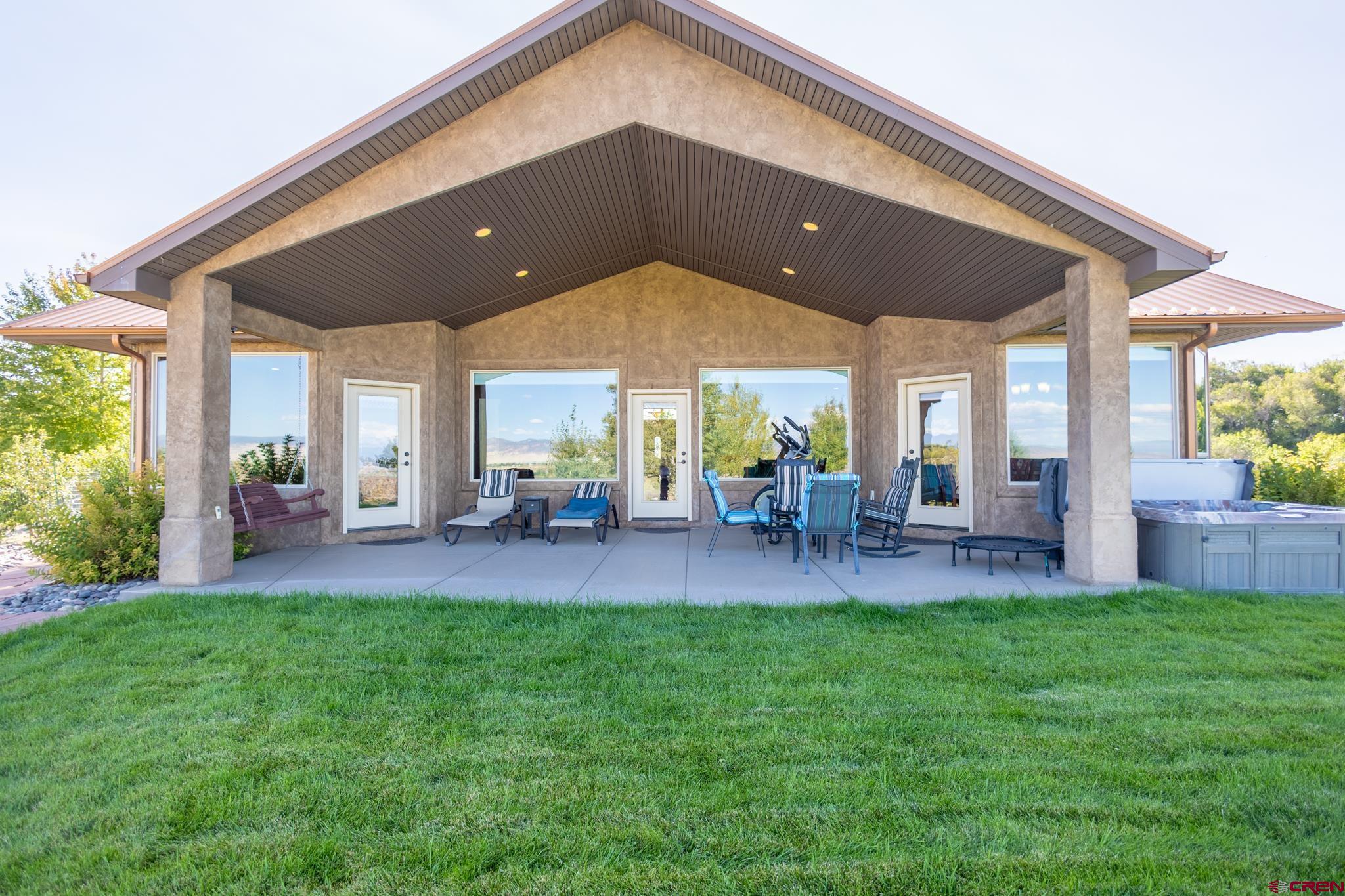 9550 High Mesa Road Olathe, CO 81425 - Photo 35 of 43 a patio with table and chairs and potted plants