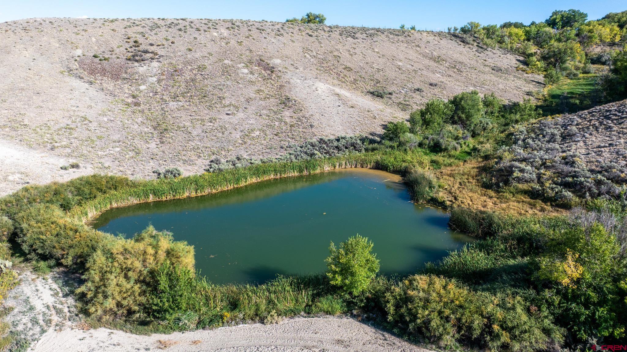 9550 High Mesa Road Olathe, CO 81425 - Photo 39 of 43 an aerial view of a house with a lake view