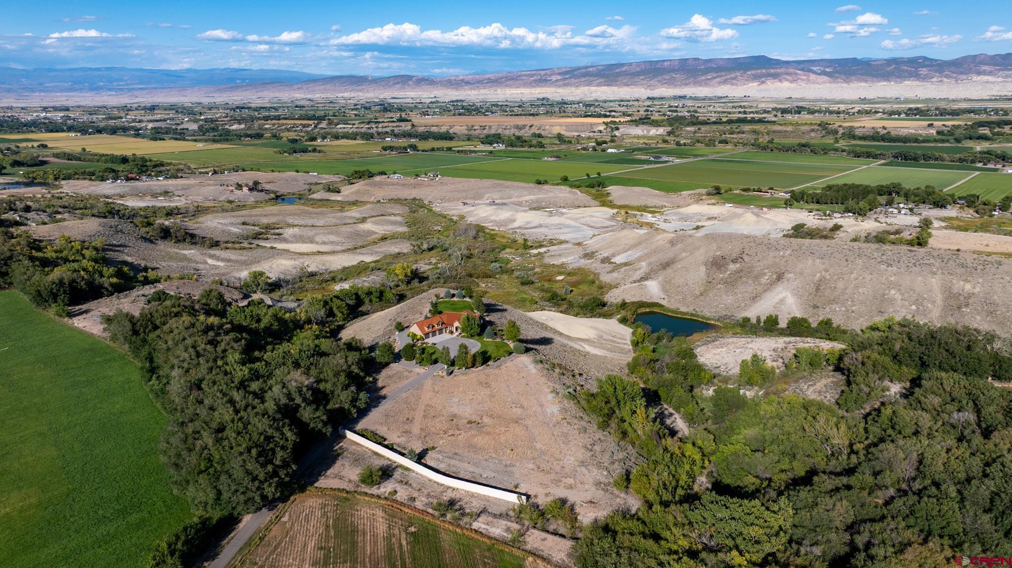 9550 High Mesa Road Olathe, CO 81425 - Photo 41 of 43 a view of a lake with a mountain