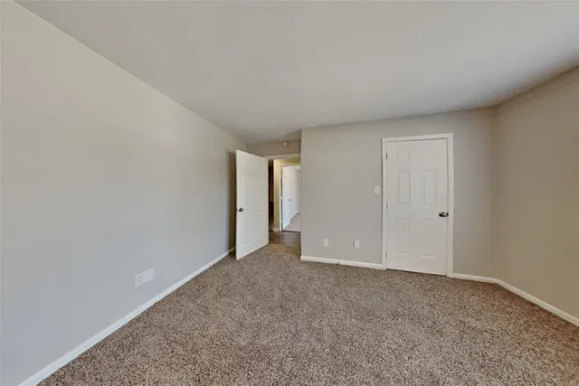 a view of an empty room and closet