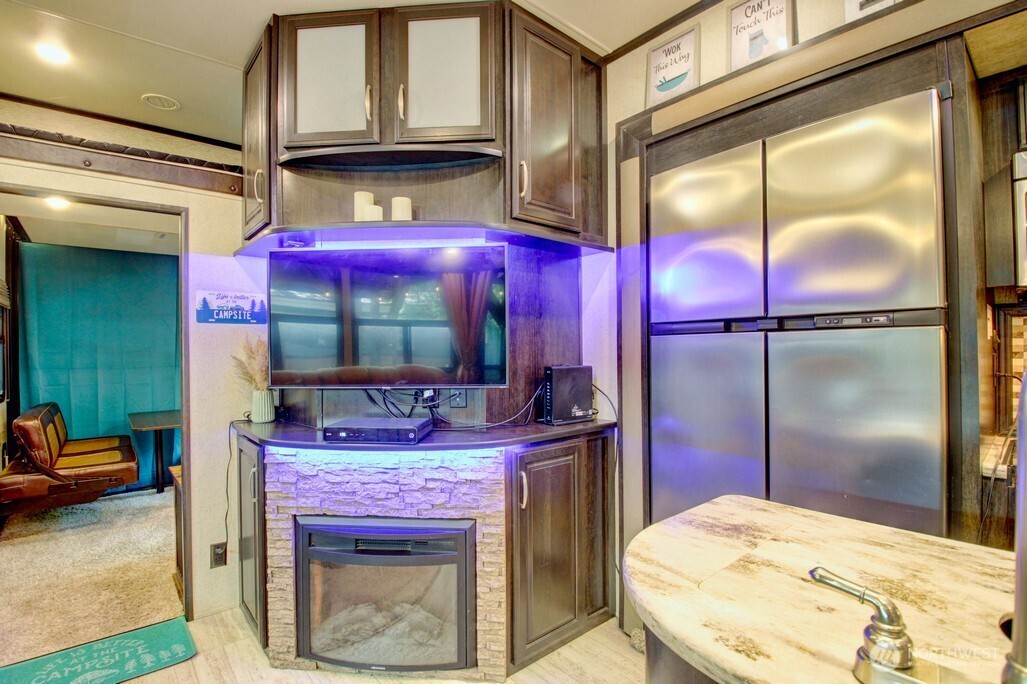 10 Riverside Drive Deming, WA 98244 - Photo 18 of 39 a kitchen with a refrigerator and a table