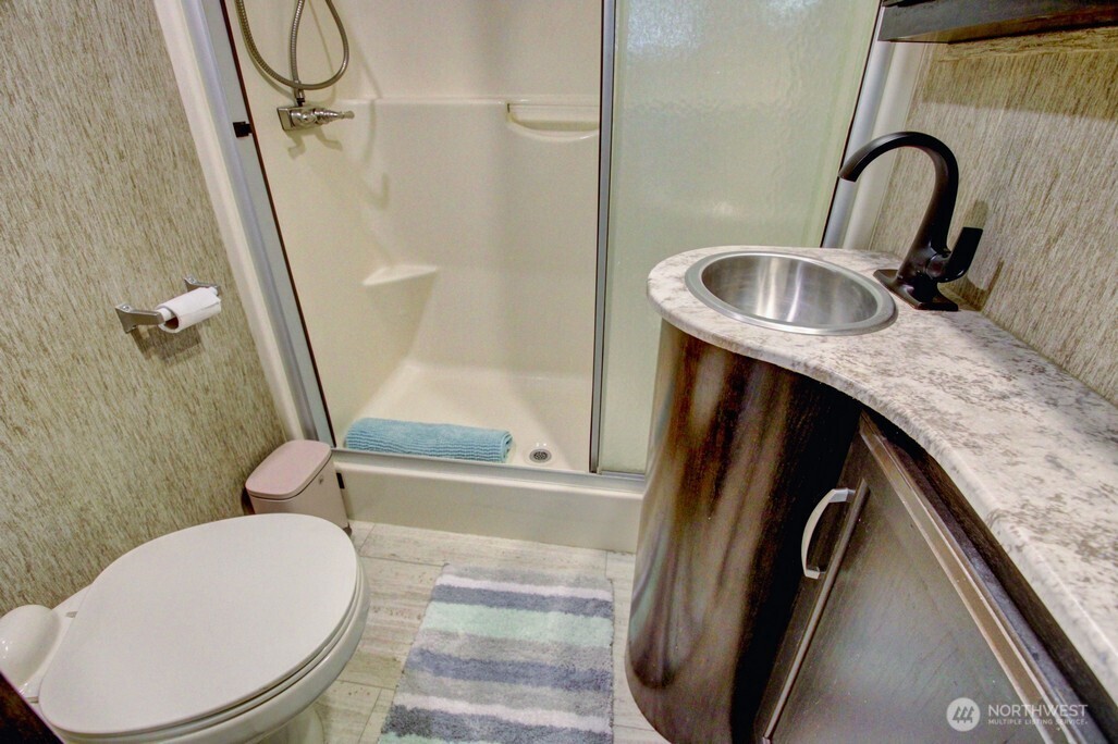 10 Riverside Drive Deming, WA 98244 - Photo 26 of 39 a bathroom with a sink a toilet and shower