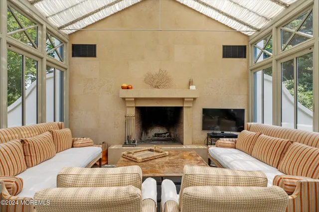 a view of a livingroom with furniture and a fireplace