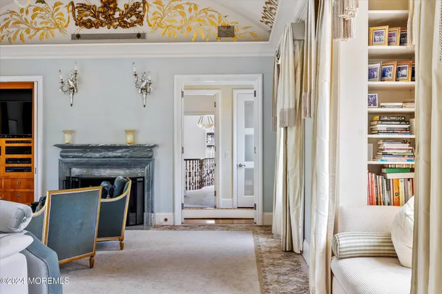 a view of a livingroom with furniture and staircase