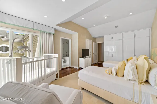 a bedroom with furniture and a window