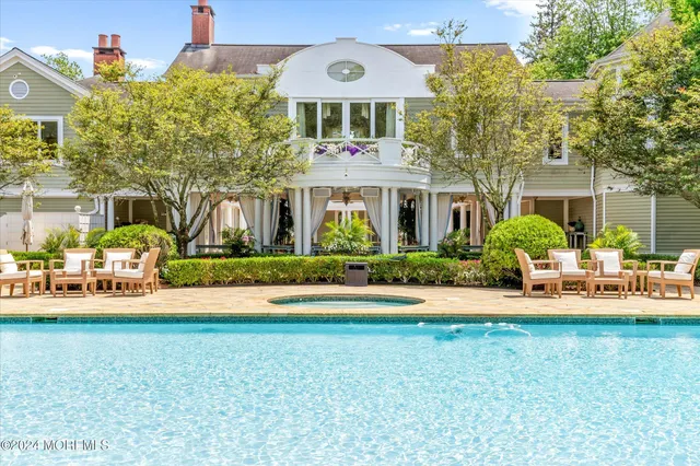 a front view of multiple houses with yard