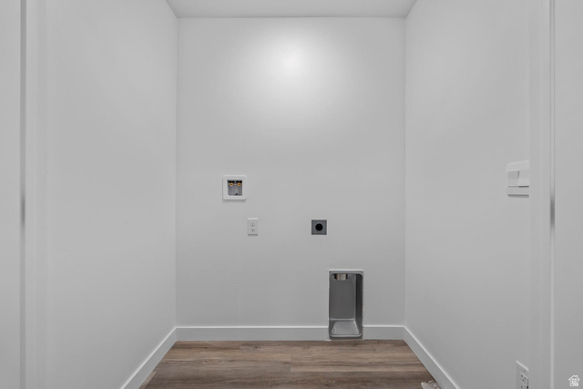 2133 Wolverine Way, Unit 2440 Washington, UT 84780 - Photo 17 of 39 Dedicated utility space featuring wood-finish flooring, white walls, and bright overhead lighting