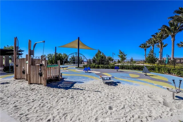 a view of a park with swings and slides