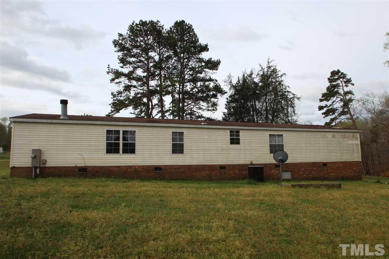 545 Duke Drive Rougemont, NC 27572 - Photo 14 of 14 a backyard that has a large tree