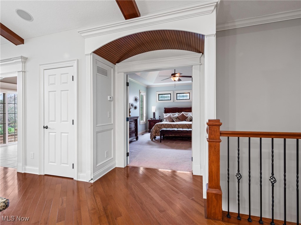 5349 Slater Ridge Westerville, OH 43082 - Photo 22 of 50 Hallway featuring dark wood-style flooring and ornamental molding