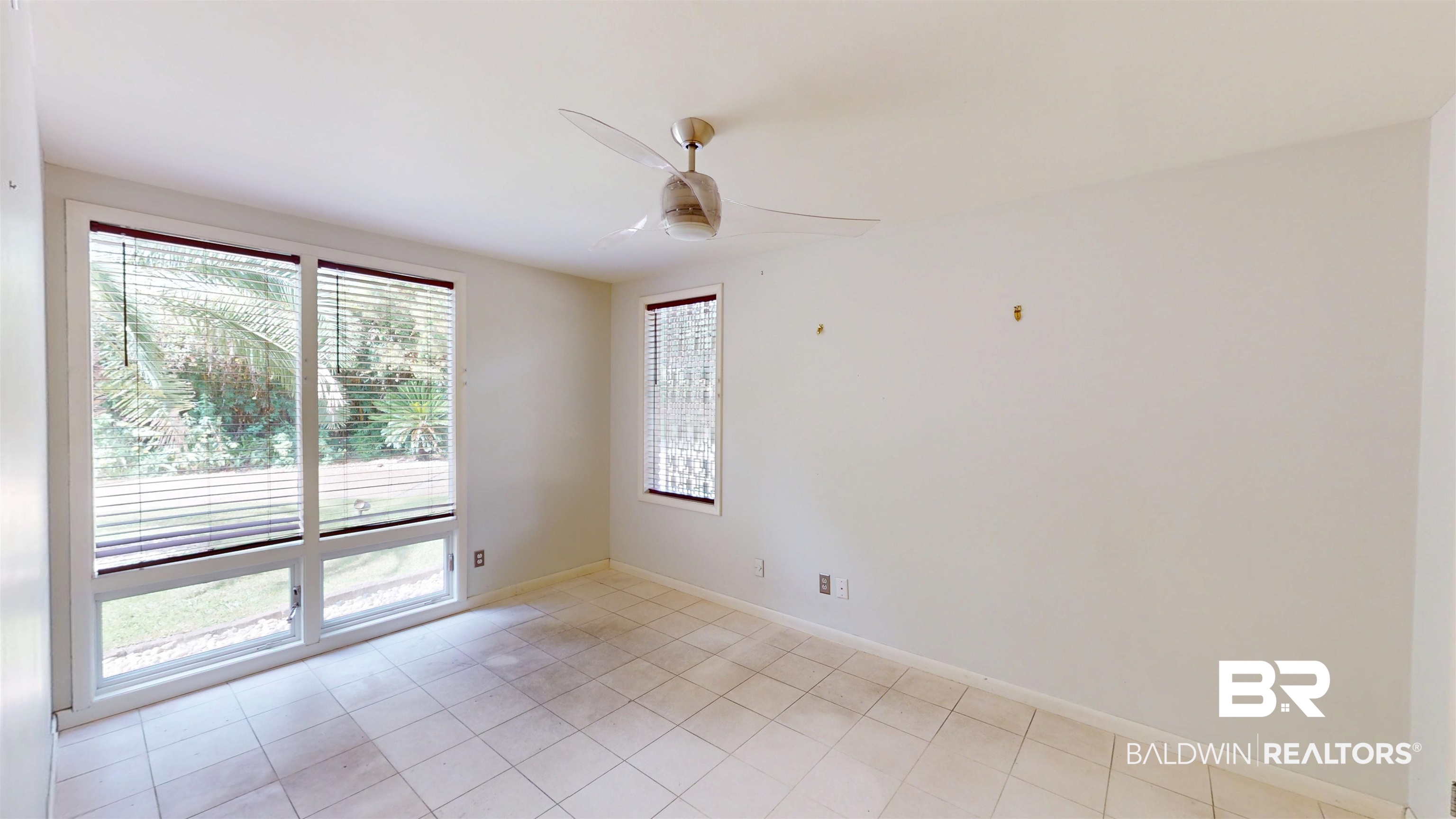 15 Spring Bank Road Mobile, AL 36608 - Photo 35 of 58 A room featuring light tile patterned floors and a ceiling fan