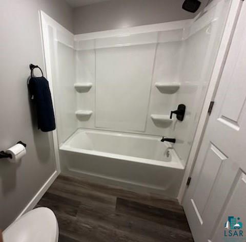 4207 Trinity Road Duluth, MN 55811 - Photo 24 of 40 Bathroom featuring shower combination, toilet, and wood-type flooring