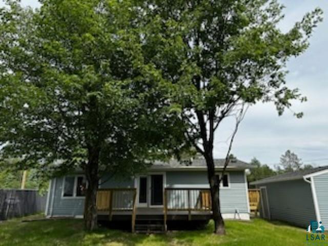 4207 Trinity Road Duluth, MN 55811 - Photo 3 of 40 Rear view of house with a lawn and a wooden deck