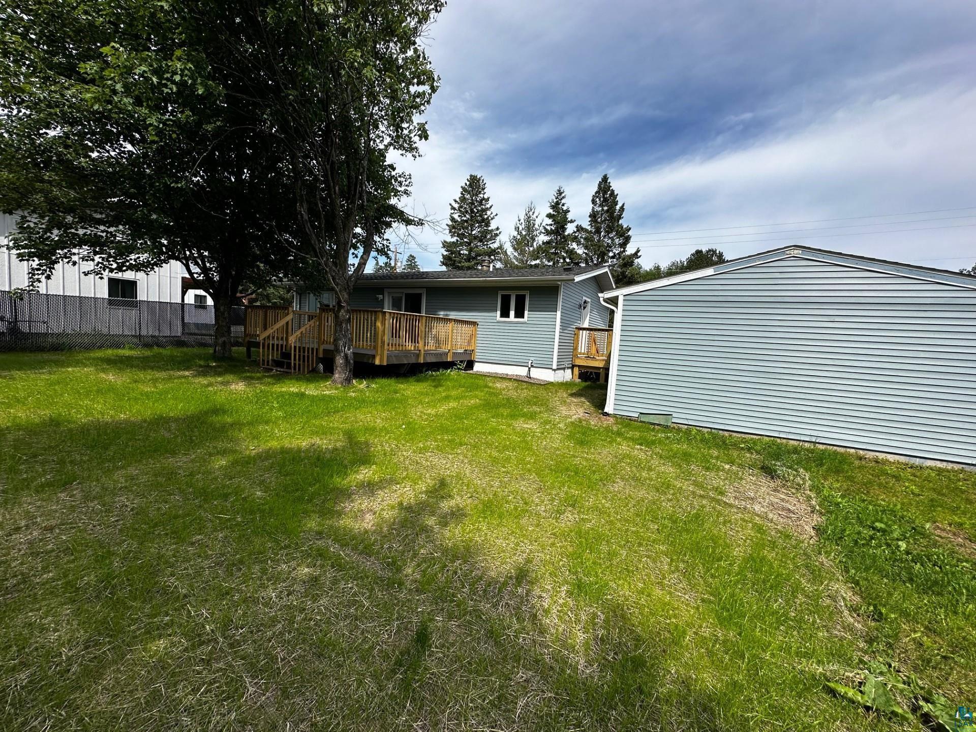 4207 Trinity Road Duluth, MN 55811 - Photo 7 of 40 View of yard with a wooden deck