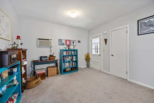 a room with furniture and a book shelf