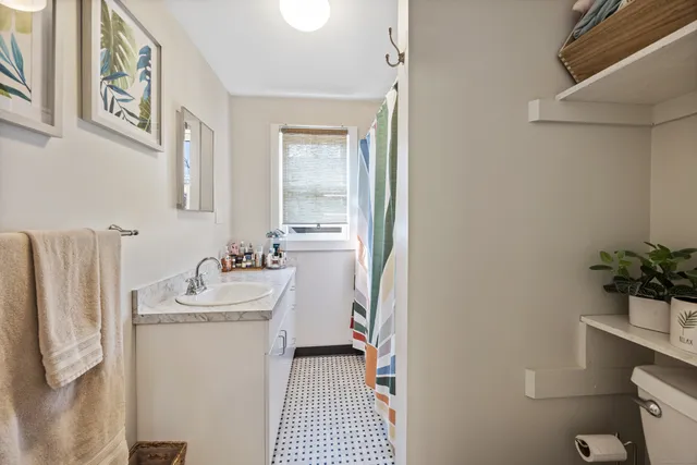 a bathroom with a sink toilet and tub