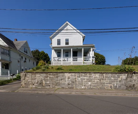 front view of a house with a small yard