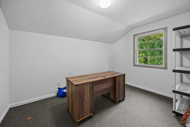 a room with a table and a window