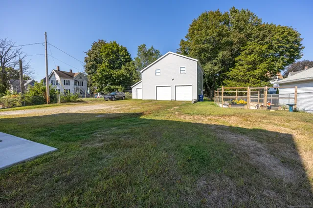 a view of a backyard with a garden and plants