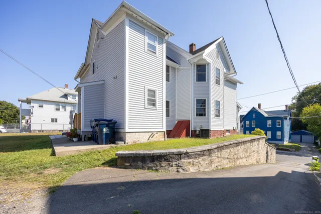 a view of a house with a yard porch and sitting area