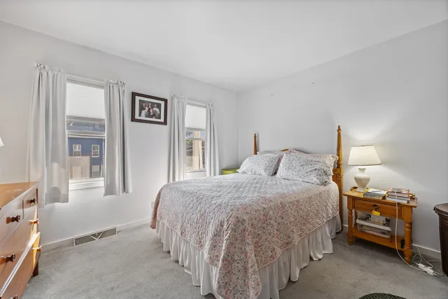 a bedroom with a bed and a cabinets