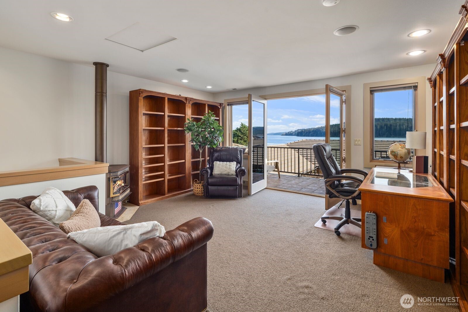 15283 Gibralter Road Anacortes, WA 98221 - Photo 29 of 40 a living room with furniture and a flat screen tv