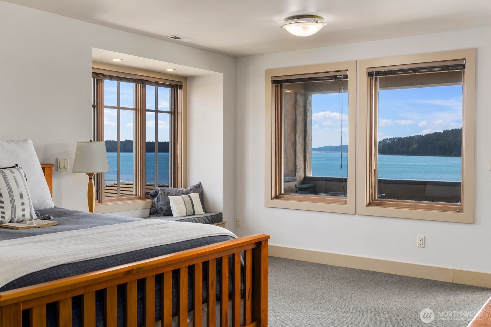 15283 Gibralter Road Anacortes, WA 98221 - Photo 33 of 40 a bedroom with a bed and a window
