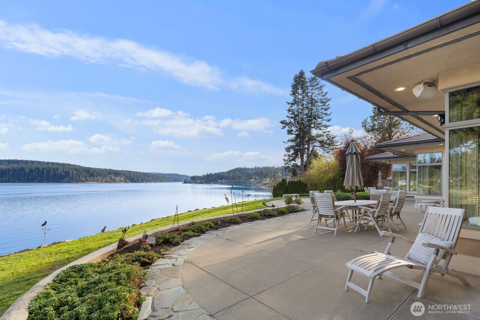 15283 Gibralter Road Anacortes, WA 98221 - Photo 34 of 40 a view of swimming pool with outdoor seating and city view