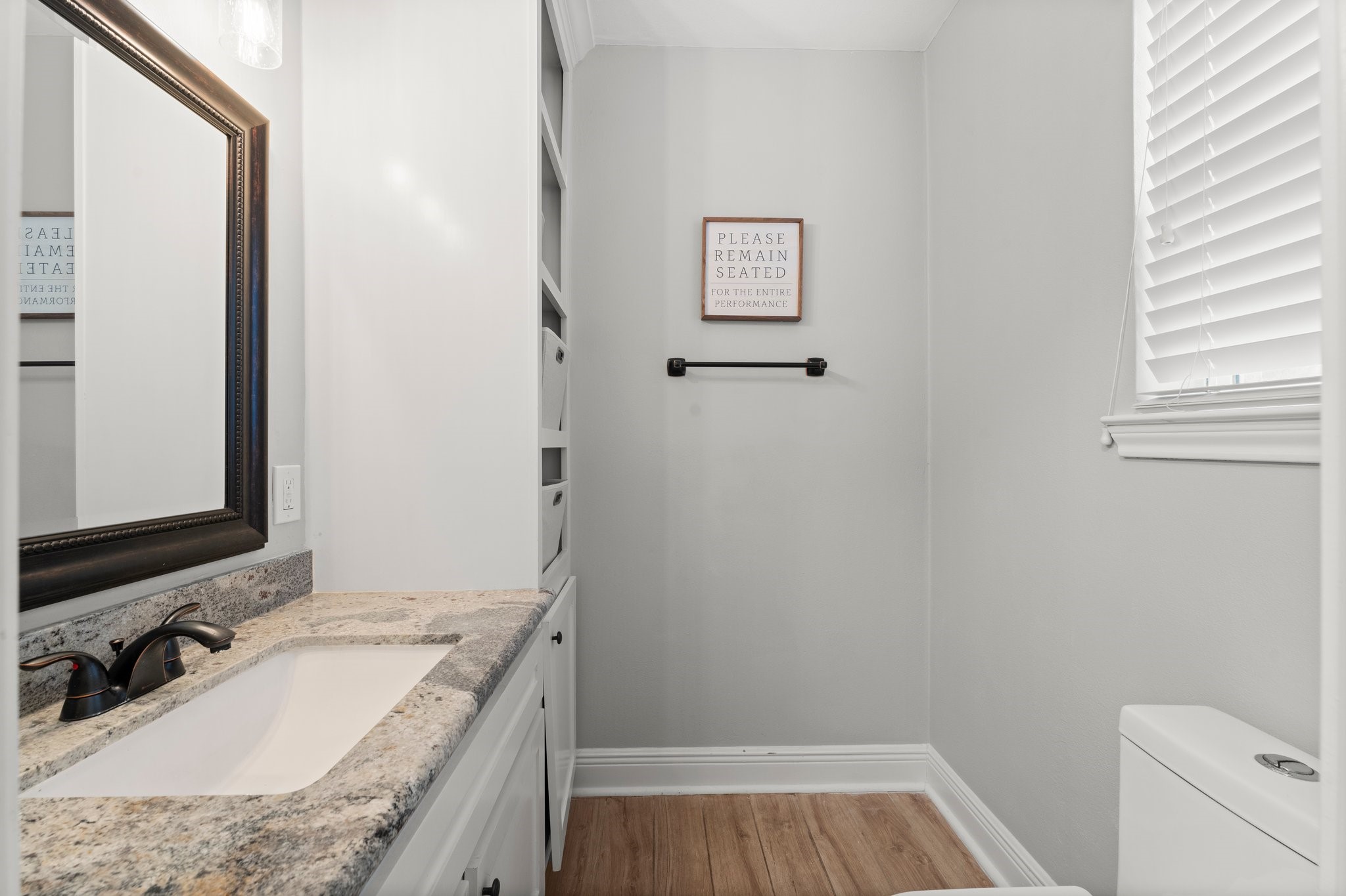 6030 Craigway Road Spring, TX 77389 - Photo 18 of 45 This bathroom includes built-in shelving for storage and a window for natural light.